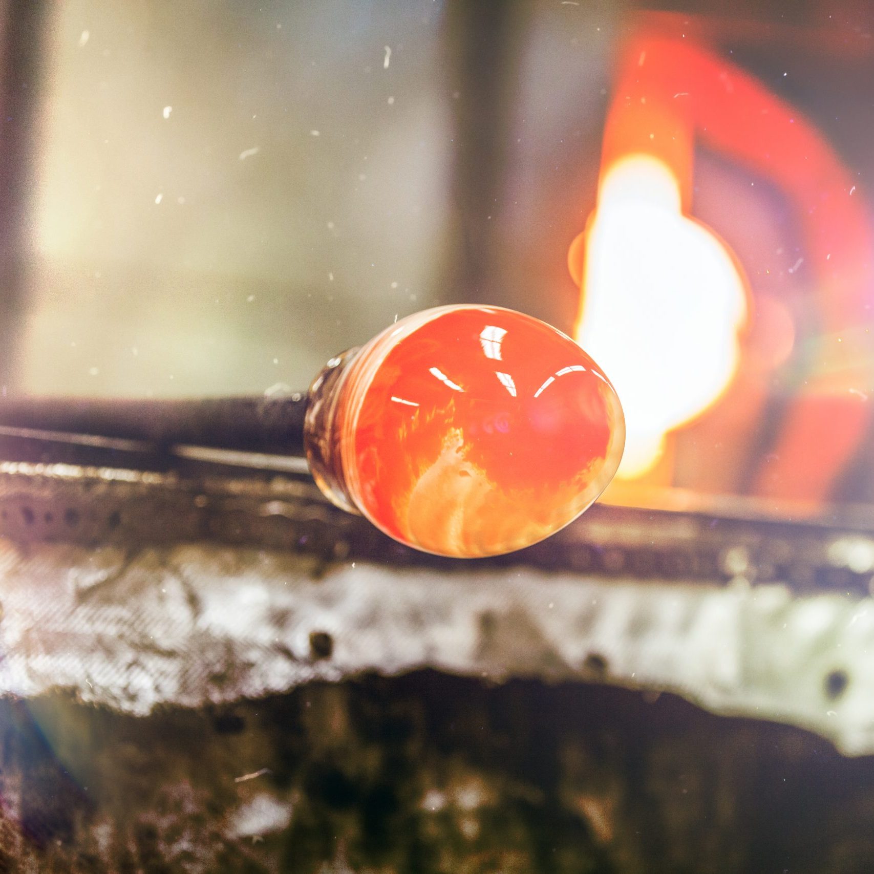 Glassblowing Piece and Furnace in Background Glass Blowers
